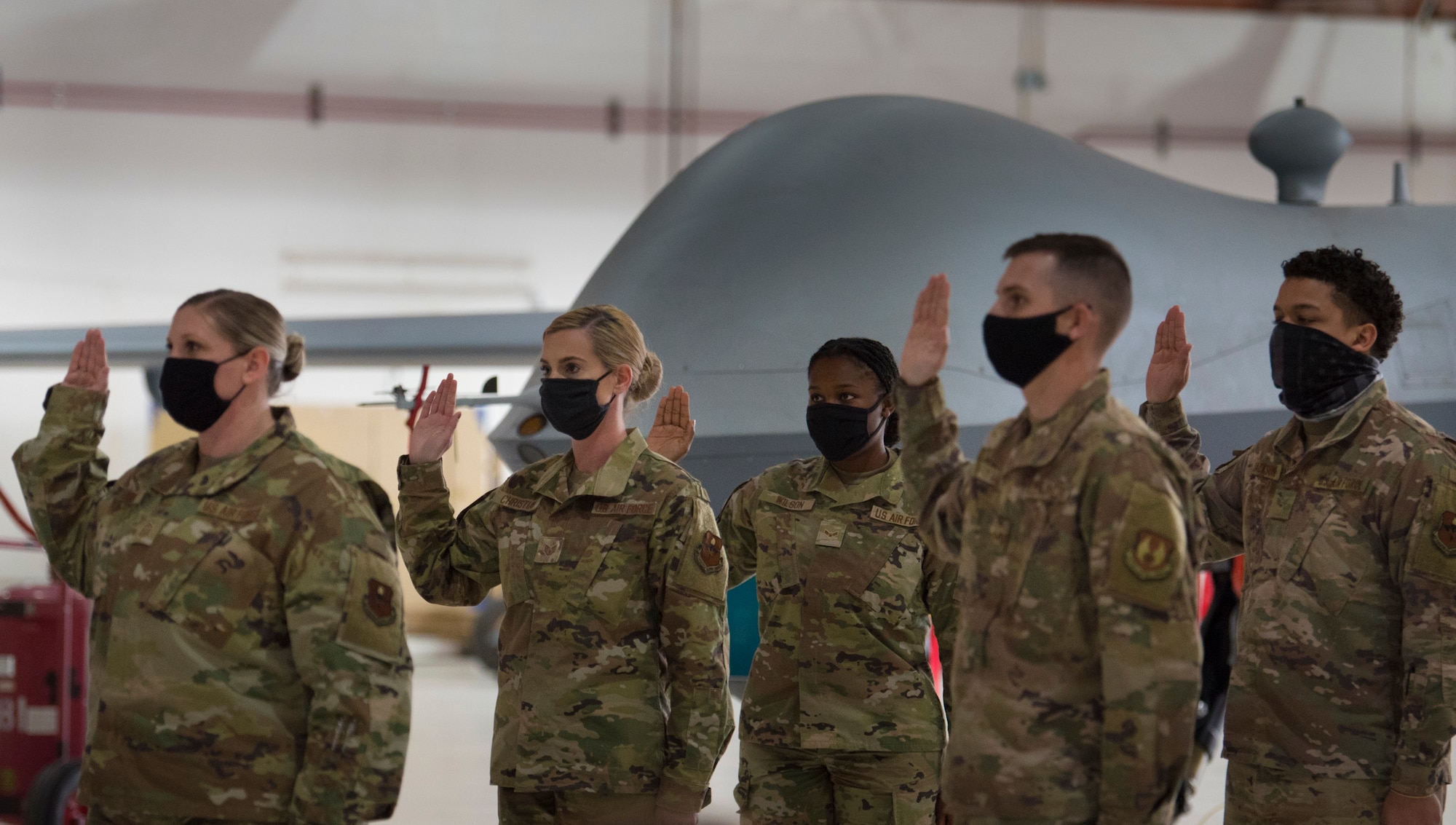 Holloman Air Force Base and Fort Bliss, Texas, Airmen take the Oath of Enlistment during U.S. Space Force transfer ceremony, Feb. 12, 2021, on Holloman Air Force Base, New Mexico. A total of 19 Airmen were chosen to transfer over to the U.S. Space Force. (U.S. Air Force photo by Airman 1st Class Jessica Sanchez)