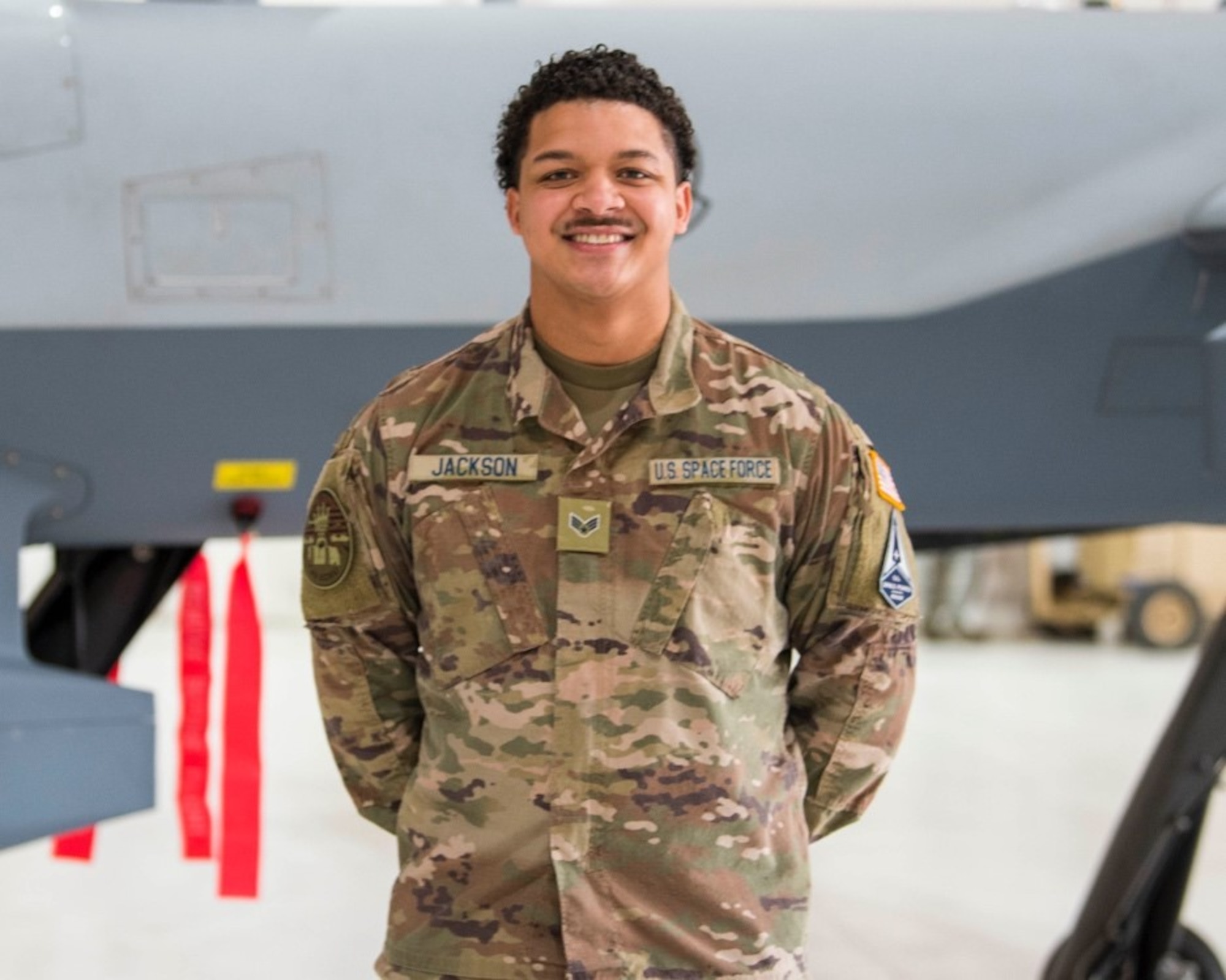 U.S. Space Force Specialist 4 Bronze Jackson, 49th Aircraft Maintenance Squadron, poses for a photo Feb. 12, 2021, on Holloman Air Force Base, New Mexico. The USSF is currently working on transferring over 6,000 Airmen from the Air Force to the Space Force by mid-2021. In Sept. 2020, the Air Force transitioned more than 2,400 active-duty Airmen in space operations and space system operations to begin establishing, maintaining, and preserving U.S. freedom of operations in space. (U.S. Air Force photo by Airman 1st Class Jessica Sanchez)