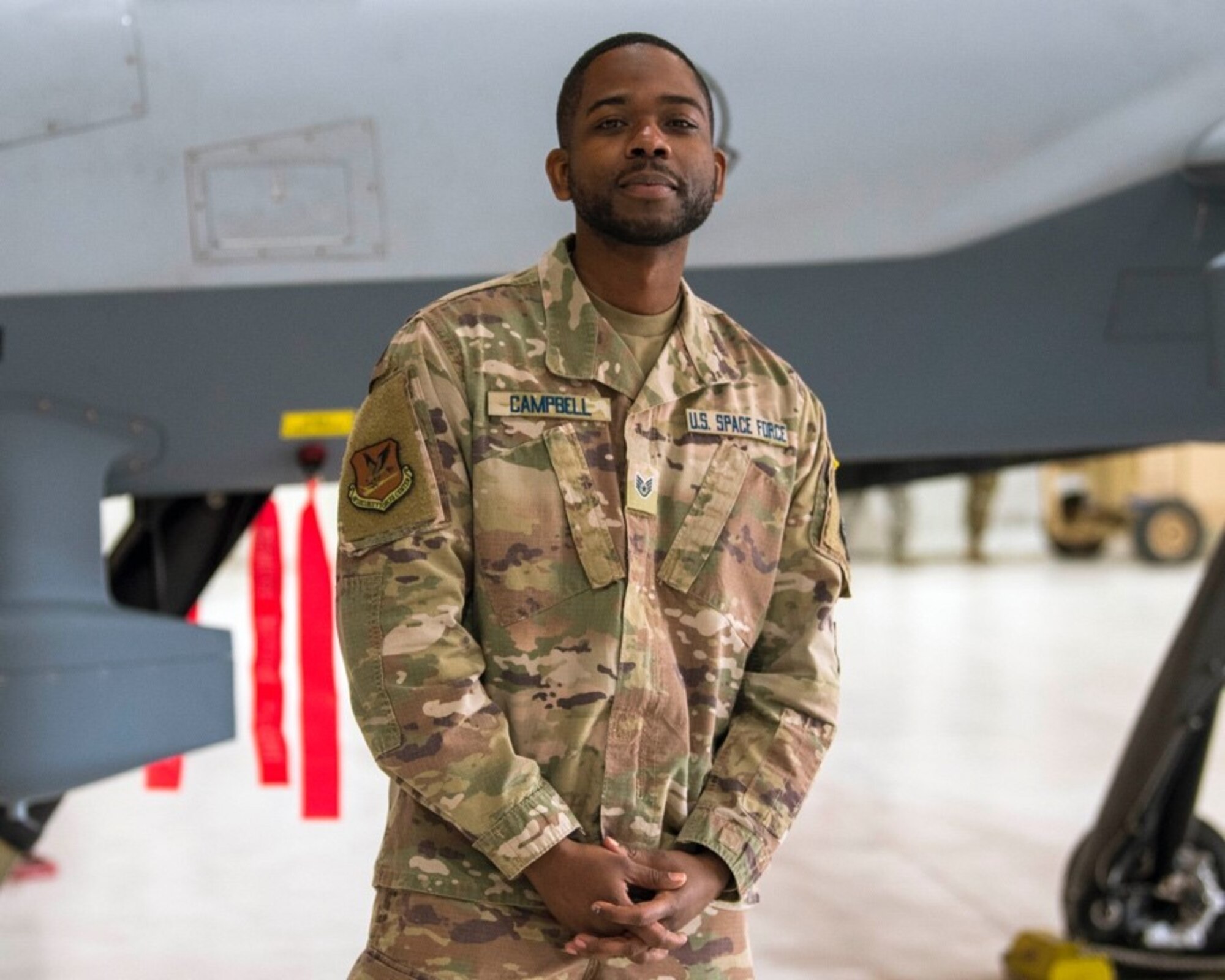 U.S. Space Force Sgt. Keontae Campbell, 49th Aircraft Maintenance Squadron, poses for a photo Feb 12, 2021, on Holloman Air Force Base, New Mexico. The USSF is currently working on transferring over 6,000 Airmen from the Air Force to the Space Force by mid-2021. In Sept. 2020, the Air Force transitioned more than 2,400 active-duty Airmen in space operations and space system operations to begin establishing, maintaining, and preserving U.S. freedom of operations in space. (U.S. Air Force photo by Airman 1st Class Jessica Sanchez)