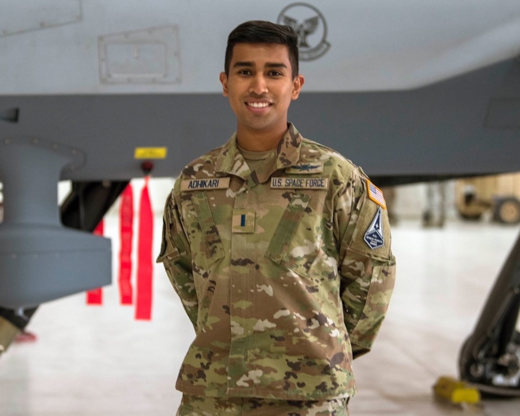 U.S. Space Force 1st Lt. Bikash Thapa Adhikari, 49th Communications Squadron, poses for a photo, Feb. 12, 2021, on Holloman Air Force Base, New Mexico. The USSF is currently working on transferring over 6,000 Airmen from the Air Force to the Space Force by mid-2021. In Sept. 2020, the Air Force transitioned more than 2,400 active-duty Airmen in space operations and space system operations to begin establishing, maintaining, and preserving U.S. freedom of operations in space. (U.S. Air Force photo by Airman 1st Class Jessica Sanchez)