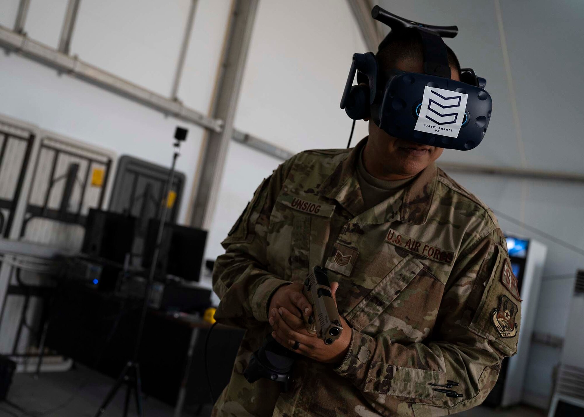 U.S. Air Force Tech. Sgt. Frank Unsioug, 380th Expeditionary Security Forces Squadron combat arms instructor, uses a virtual reality (VR) system in a simulated response at Al Dhafra Air Base, United Arab Emirates, Jan. 20, 2020.