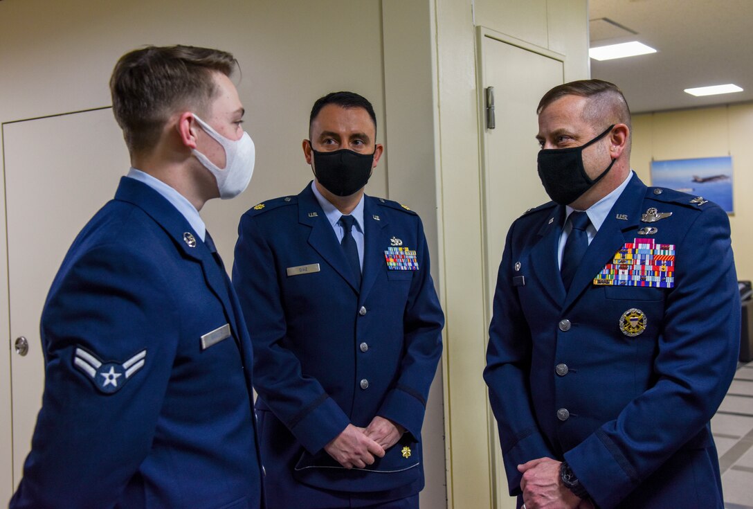 U.S. Air Force Col. Jesse J. Friedel, right, 35th Fighter Wing commander, thanks Airman 1st Class Hunter Wells, left, 35th Logistics Readiness Squadron Installation Deployment Readiness Center logistics planner, for his work in coordinating the Memorandum of Understanding 3010 at Misawa Air Base, Japan, Feb. 12, 2021. Wells and other members from various agencies around base worked tirelessly to coordinate the agreement of MOUI 3010, which is the first agreement of its kind to be signed in more than 20 years at Misawa. (U.S. Air Force photo by Tech. Sgt. Timothy Moore)