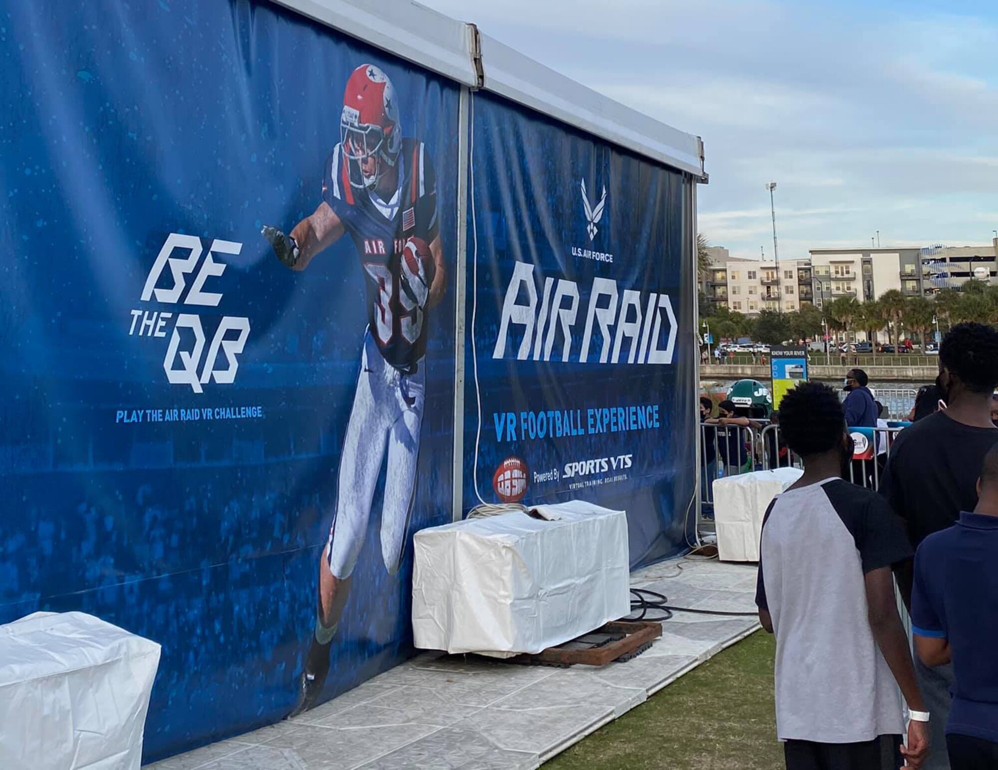 Super Bowl fans wait in line to experience the Air Force’s AIR RAID QB SIM Experience at the Super Bowl LV experience outside of Raymond James Stadium in Tampa, Florida, Jan. 31, 2021.