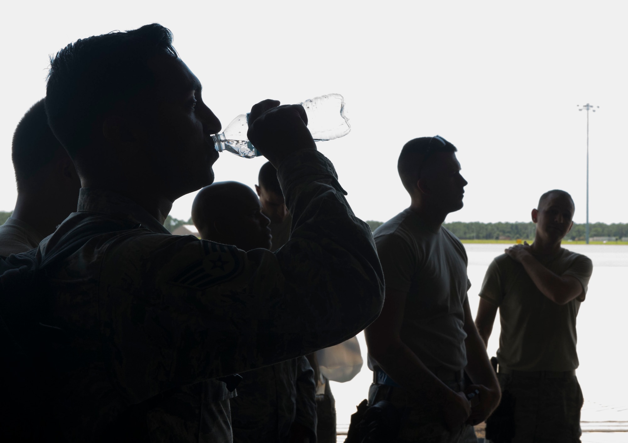 An Airman assigned to the 621st Contingency Response Wing drinks water after unloading cargo during the CRW's support of the Hurricane Irma relief efforts at MacDill, Air Force Base, Fla., September 12, 2017.