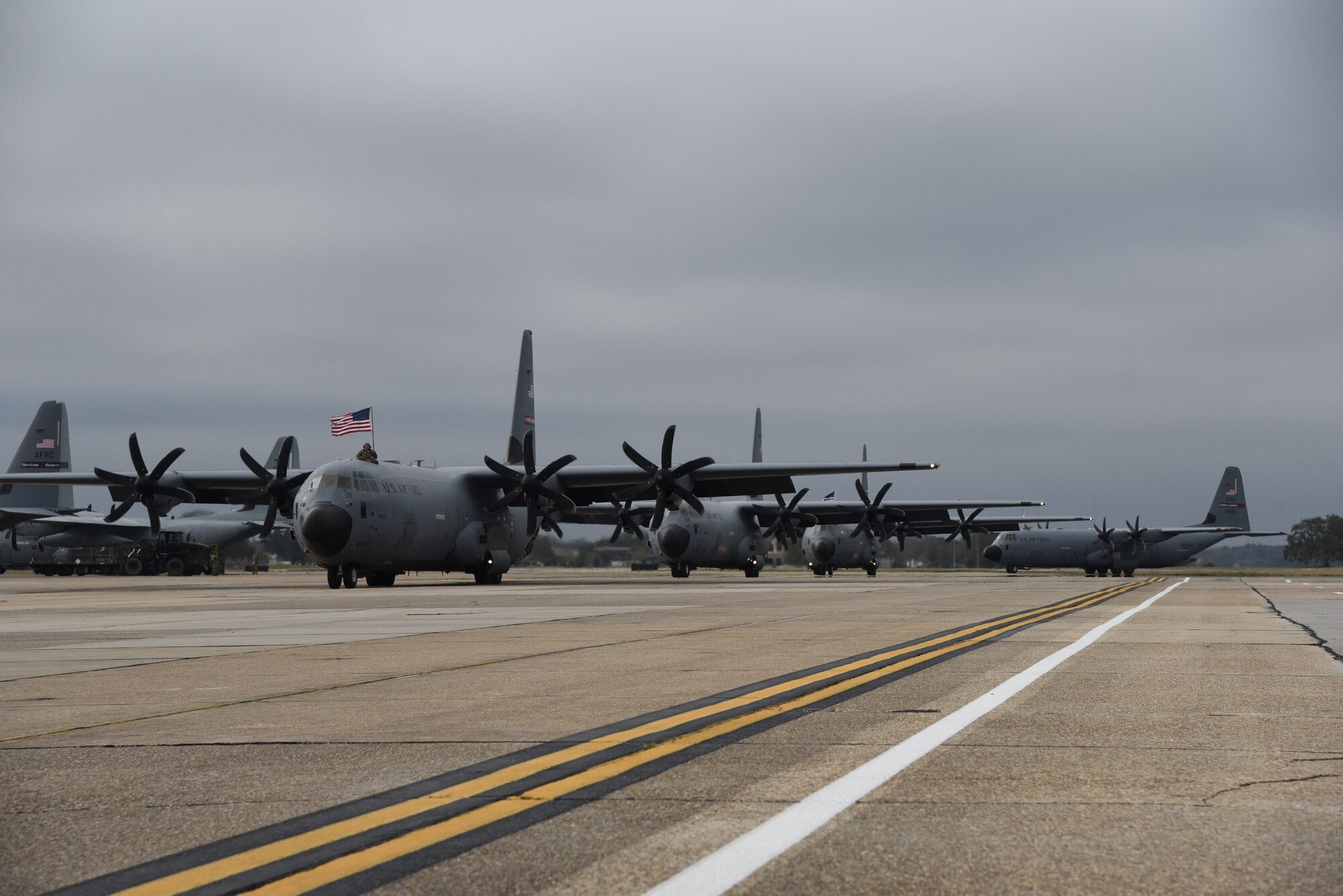 Family members await the return of their Reserve Citizen Airmen to Keesler Air Force Base, Mississippi, Feb. 13, 2021. Airmen from the 815th Airlift Squadron and maintenance and personnel from throughout the 403rd Wing were deployed to Southwest Asia where they supported Operations Freedom Sentinel and Inherent Resolve. (U.S. Air Force photo by Lt. Col. Marnee A.C. Losurdo)