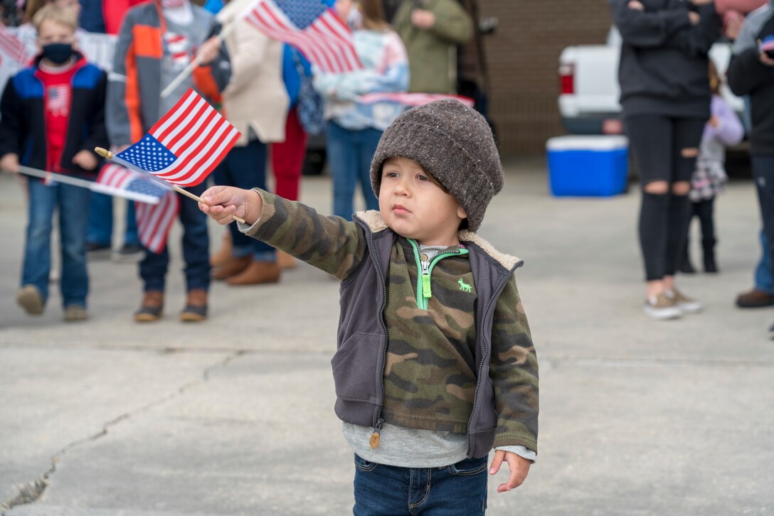 Family members await the return of their Reserve Citizen Airmen to Keesler Air Force Base, Mississippi, Feb. 13, 2021. Airmen from the 815th Airlift Squadron and maintenance and personnel from throughout the 403rd Wing were deployed to Southwest Asia where they supported Operations Freedom Sentinel and Inherent Resolve. (U.S. Air Force photo by 2nd Lt. Christopher Carranza)