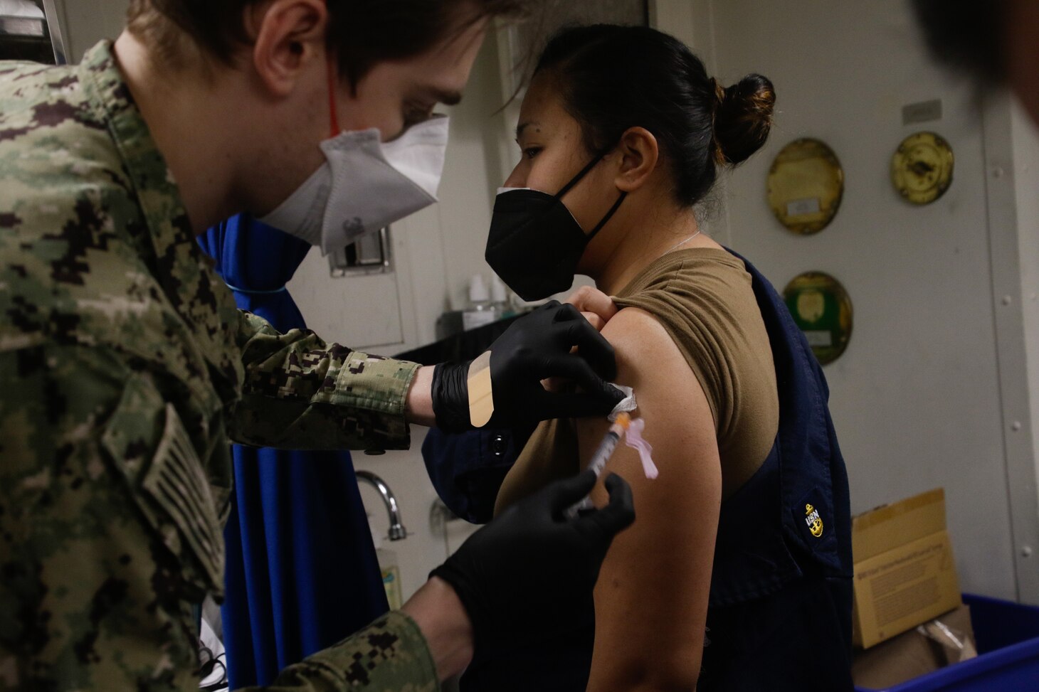 Sailors receive the COVID-19 vaccine aboard USS Mahan (DDG 72).
