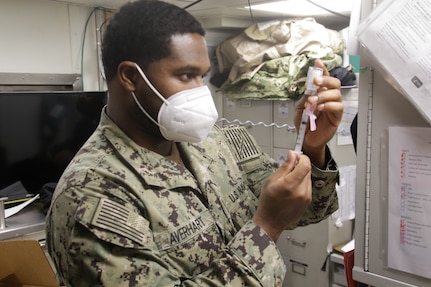 Sailors receive the COVID-19 vaccine aboard USS Mahan (DDG 72).