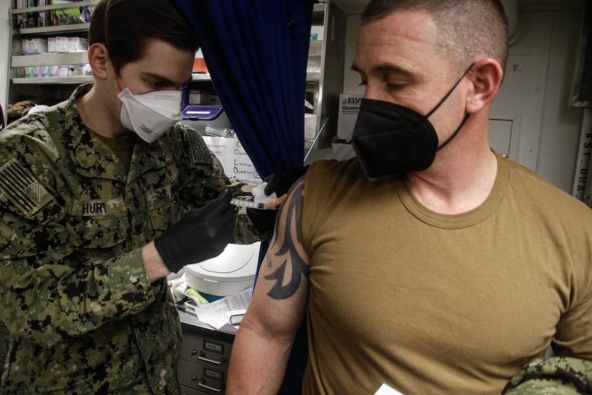 Sailors receive the COVID-19 vaccine aboard USS Mahan (DDG 72).