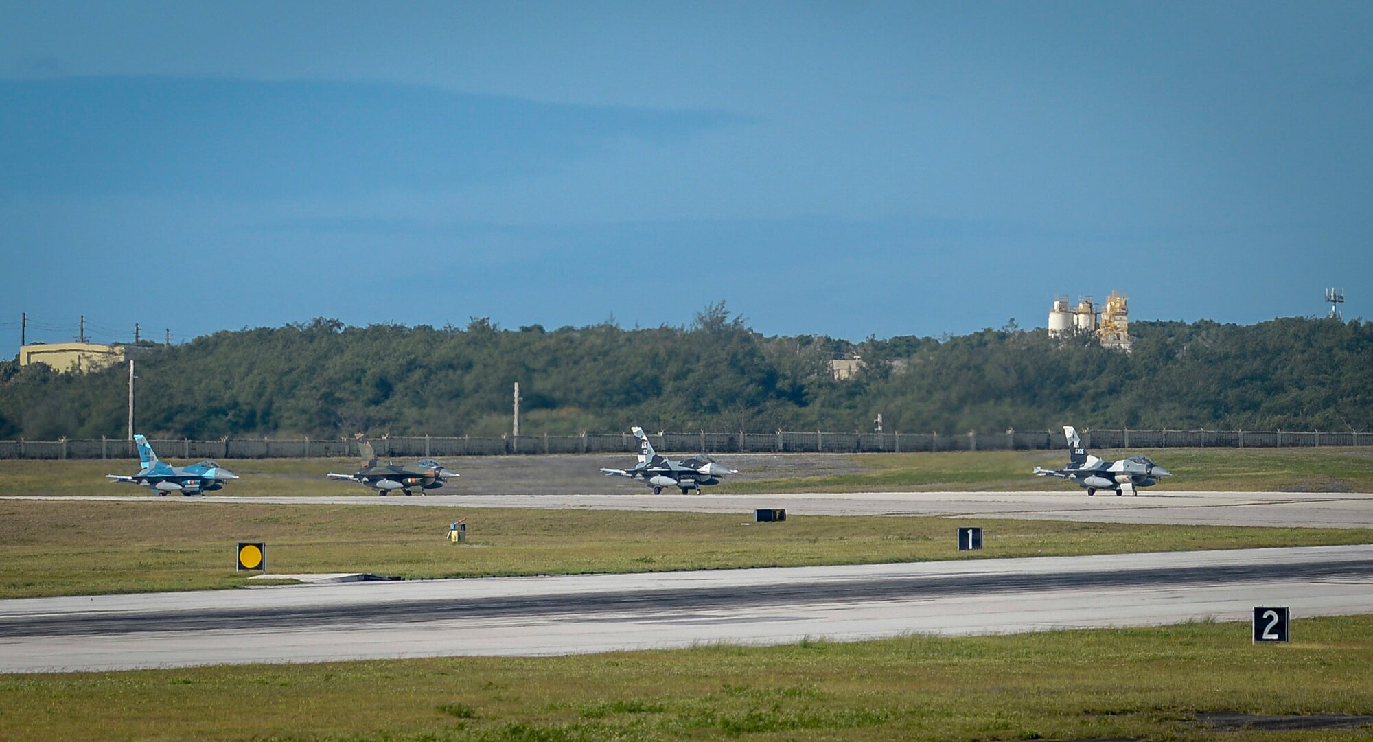 Four U.S. Air Force F-16 Fighting Falcons assigned to the 18th Aggressor Squadron, Eielson Air Force Base, Alaska, taxi on the flight line during exercise Cope North 2021 at Andersen Air Force Base, Guam, Feb. 11, 2021.