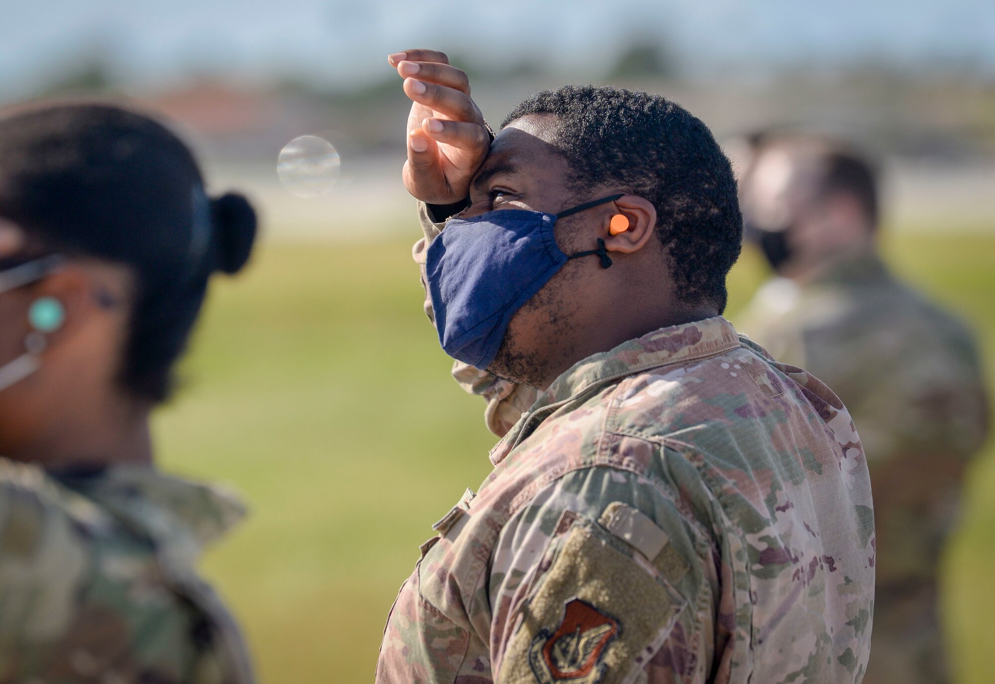 U.S. Air Force Staff Sgt. David Corbett, quality assurance manager assigned to the 36th comptroller squadron, watch an aircraft take off during a group flight line engagement for exercise Cope North 2021 at Andersen Air Force Base, Guam, Feb. 11, 2021.