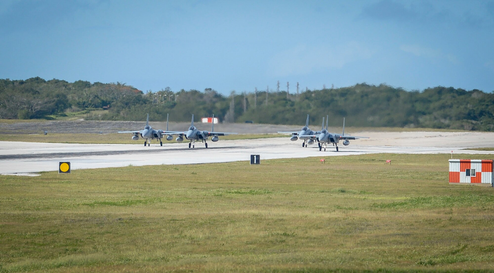 Four Japan Air Self-Defense Force, or Koku-Jieitai, F-15J Eagles assigned to the 201st Squadron, Chitose Air Base, Japan, taxi on the flight line during exercise Cope North 2021 at Andersen Air Force Base, Guam, Feb. 11, 2021.