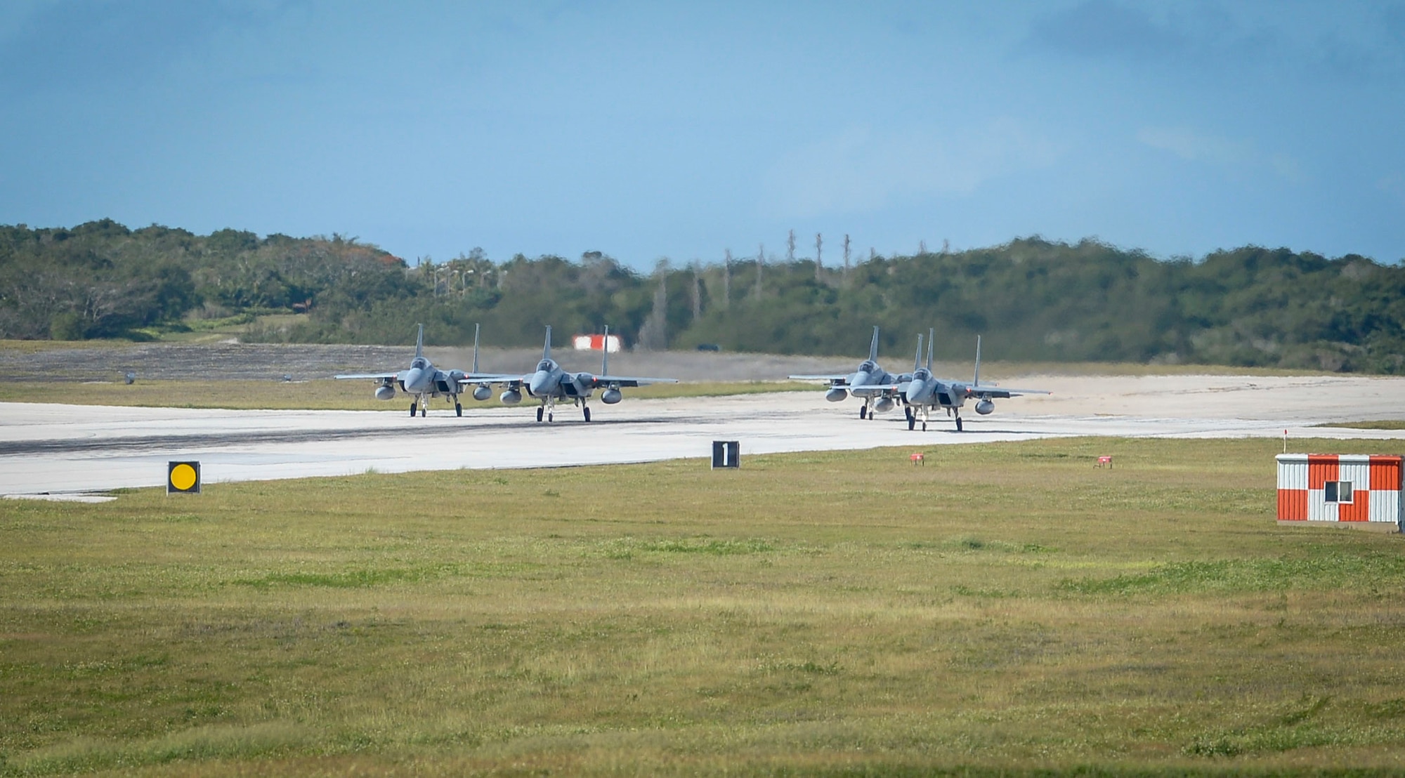 Four Japan Air Self-Defense Force, or Koku-Jieitai, F-15J Eagles assigned to the 201st Squadron, Chitose Air Base, Japan, taxi on the flight line during exercise Cope North 2021 at Andersen Air Force Base, Guam, Feb. 11, 2021.
