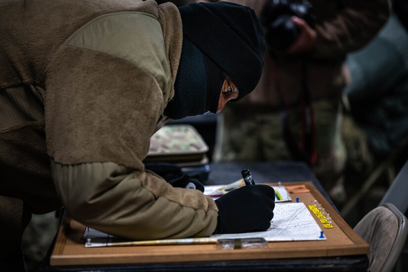 A Soldier reads a map.