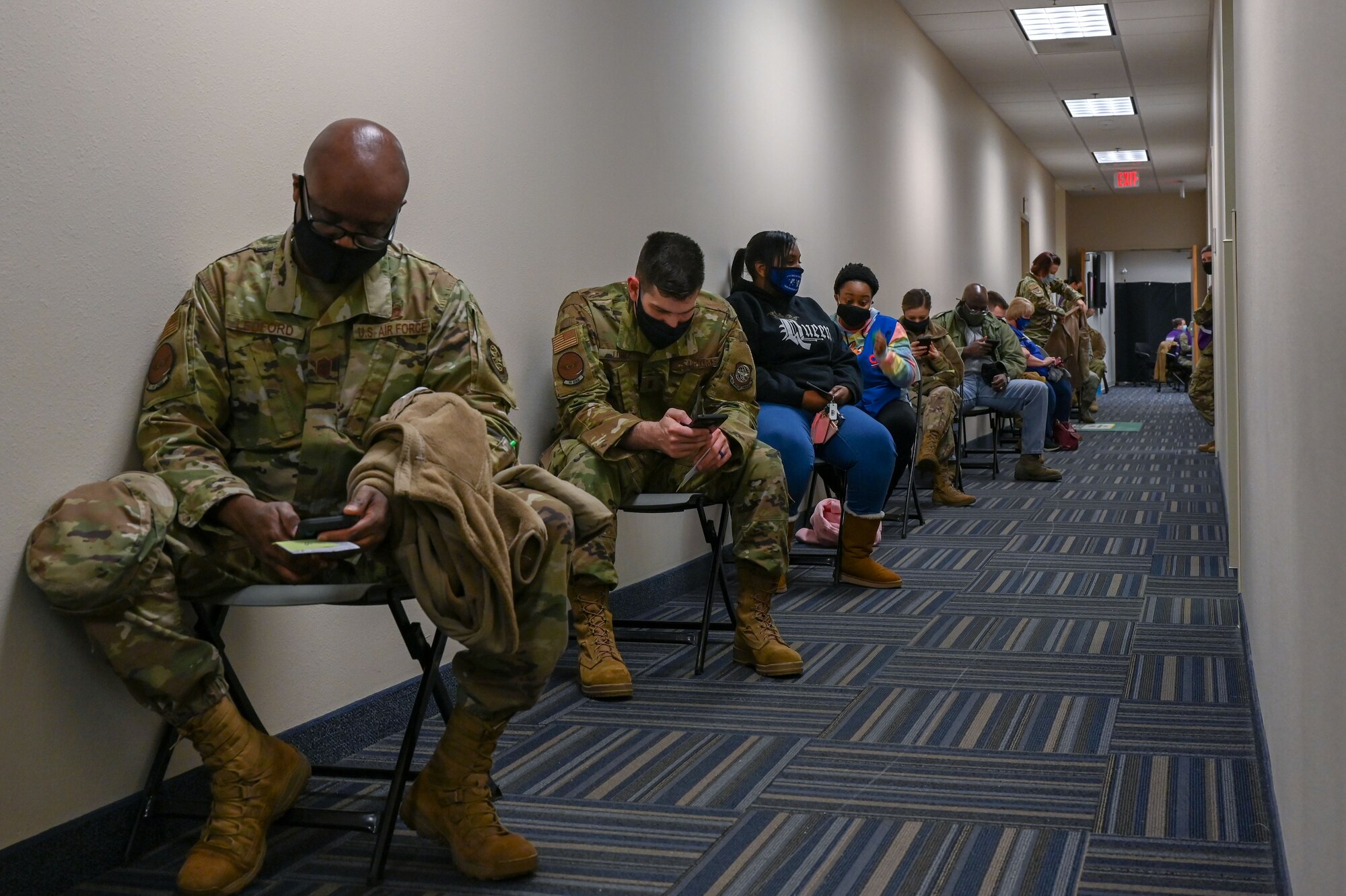 People wait in a hallway