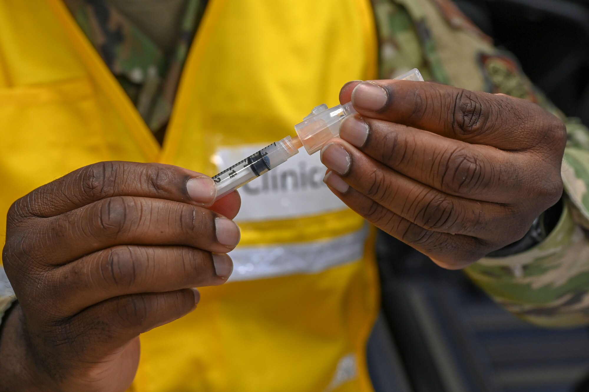 A vial is held