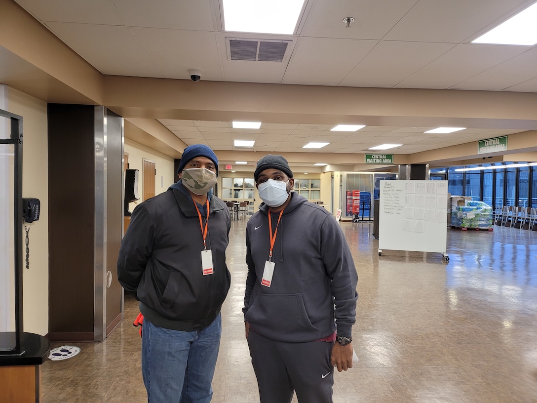 Lt. Col. Scotty Jackson and Staff Sgt. Ricardo Garrett with the 3d Medical Command (Deployment Support), post for a photo at the Atlanta VA as part of their volunteer support of the VA's Covid-19 vaccine drive-thru.
Staff Sgt. Garrett was most responsible for organizing the volunteer effort.