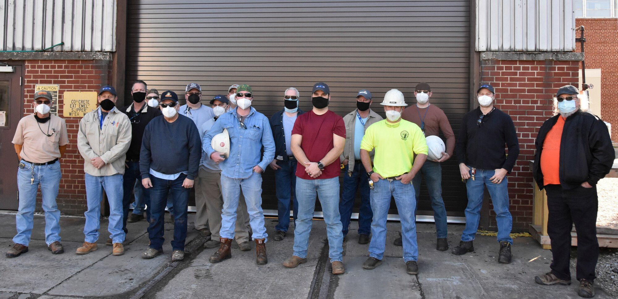 Arnold Air Force Base craft personnel who completed the recent removal of nearly 2,500 feet of insulation from high-pressure air lines gather for a photo outside the Model and Machine Shop Jan. 26, 2021, at Arnold AFB, Tenn. The team worked quickly to remove the insulation during a recent four-day high-pressure air. (U.S. Air Force photo by Bradley Hicks)