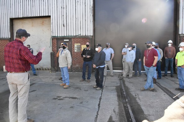 On Jan. 26, 2021, Warner Holt, Group manager for Manufacturing Services with the Test Operations and Sustainment contractor at Arnold Air Force Base, Tenn., left, offers his appreciation to craft personnel who recently worked to remove nearly 2,500 feet of insulation from a pair of high-pressure air lines. The job was completed during a recent four-day outage. (U.S. Air Force photo by Bradley Hicks) (This image was altered by obscuring badges for security purposes.)