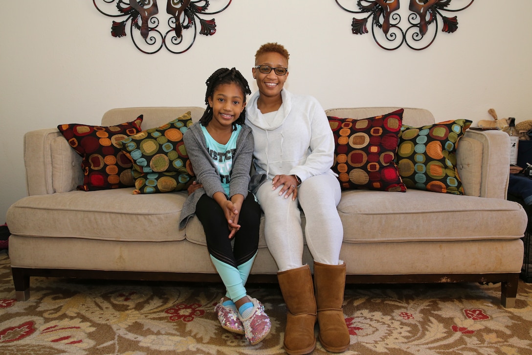 U.S. Marine Corps Sgt. Janey Conerly poses with her daughter, Loghan, in their home at Marine Corps Base Quantico, Virginia, Feb. 4, 2021. Conerly is an administrative clerk at Marine Corps Recruiting Command. Conerly reflected on her family upbringing as well as African American leaders from past and present who have inspired her, as she celebrates National African American History Month. “Because of my race, and I also know the history of my race and what we had to go through, I do take pride in being Black/ African American,” Conerly said. “I take pride in all the changes that the ones before me fought for…I take pride in us being us…I take pride in everything I do that comes with being Black/ African American. And that’s just because of the ones before me — the amount of work and the challenge that they endured for me to be able to live African American/ Black.” (U.S. Marine Corps photo by Cpl. Naomi May)
