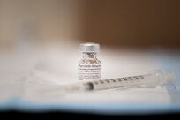 A vial of the COVID-19 vaccine is prepared to be administered at Walter Reed National Military Medical Center, Bethesda, Md., Dec. 21, 2020. (DOD Photo by Navy Petty Officer 1st Class Carlos M. Vazquez II)