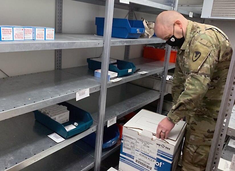 Maj. Race Dulin inspects incoming vaccine shipments at the U.S. Army Medical Materiel Center-Europe, which has been providing logistical support for the distribution of vaccine in response to the global COVID-19 pandemic.
