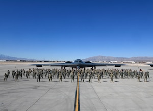 Multiple 393rd Expeditionary Bomb Squadron Airmen stand for a group photo during Red Flag 21-1, Feb. 6, 2021, at Nellis Air Force Base, Nevada. Along with aircrew, approximately 100 Team Whiteman Airmen participated in the large-force exercise as the lead wing. As the lead wing, RF 21-1 enabled Team Whiteman Airmen to maintain a high state of readiness and proficiency, while validating their always-ready global strike capability. (U.S. Air Force photo by Staff Sgt. Sadie Colbert)