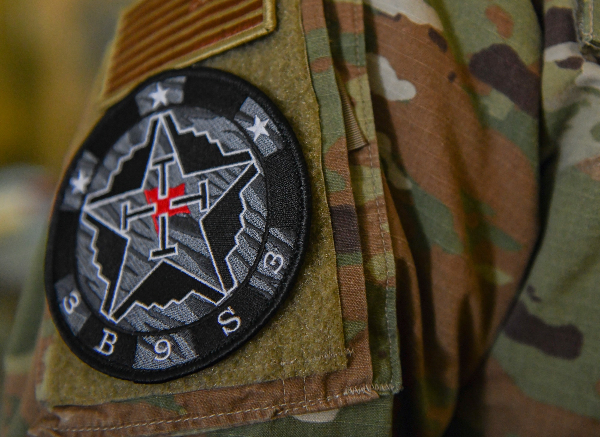 An Airman displays a 393rd Expeditionary Bomb Squadron patch during Red Flag 21-1, Feb. 12, 2021, at Nellis Air Force Base, Nevada. In order to ensure Team Whiteman always upholds its global deterrence responsibility, Red Flag challenged Airmen to operate in a limited environment to better enhance their readiness and ensure mission success. Aircrews rotated their mission duties throughout the large-force exercise, expanding their ability to plan and execute operations best fit for various contingency scenarios. (U.S. Air Force photo by Staff Sgt. Sadie Colbert)