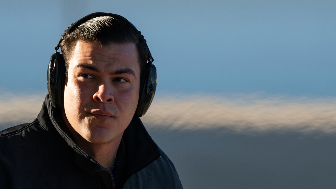 An Air Force Maintainer looking off-camera.