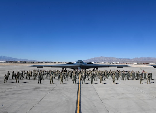 Multiple 393rd Expeditionary Bomb Squadron Airmen stand for a group photo during Red Flag 21-1, Feb. 6, 2021, at Nellis Air Force Base, Nevada. Along with aircrew, approximately 100 Team Whiteman Airmen participated in the large-force exercise as the lead wing. As the lead wing, RF 21-1 enabled Team Whiteman Airmen to maintain a high state of readiness and proficiency, while validating their always-ready global strike capability. (U.S. Air Force photo by Staff Sgt. Sadie Colbert)