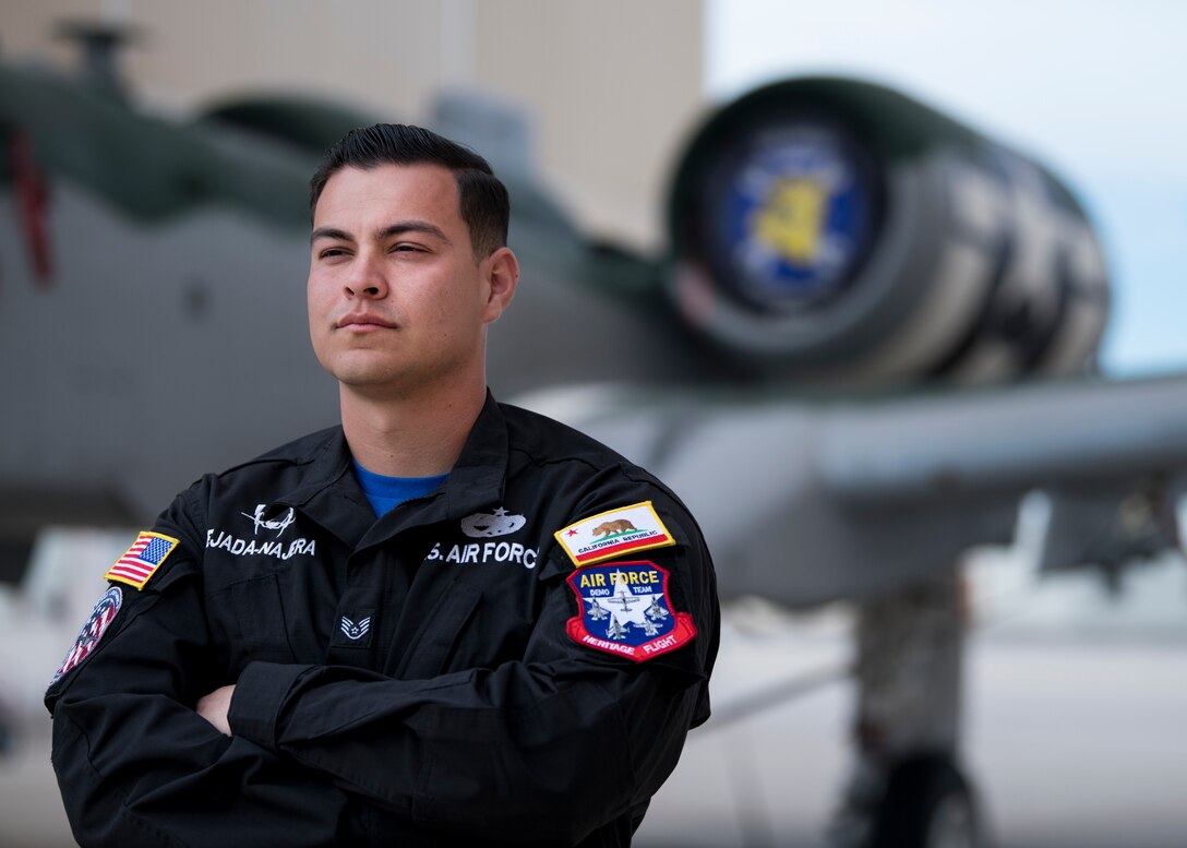 A maintainer stands in front of an A-10 Warthog.