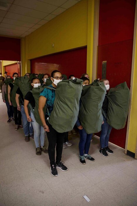 New recruits with Lima Company, 3rd Recruit Training Battalion, participate in the receiving process at Marine Corps Recruit Depot, San Diego, Feb. 9, 2021.