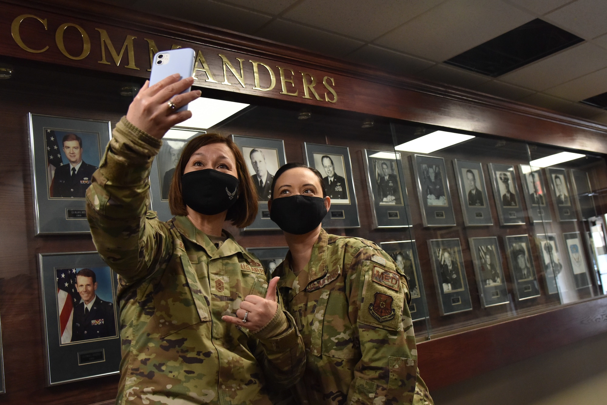 Chief Master Sgt. of the Air Force JoAnne S. Bass poses for a photo with Tech. Sgt. Danielle De Leon, 341st Healthcare Operations Squadron family health flight chief, during a coining ceremony Feb. 9, 2021, at Malmstrom Air Force Base, Mont. De Leon received a coin in place for Airman 1st Class Jepsy Magno, 341st HCOS aerospace medical technician, who was recognized as one of the 341st Missile Wing’s outstanding performers.