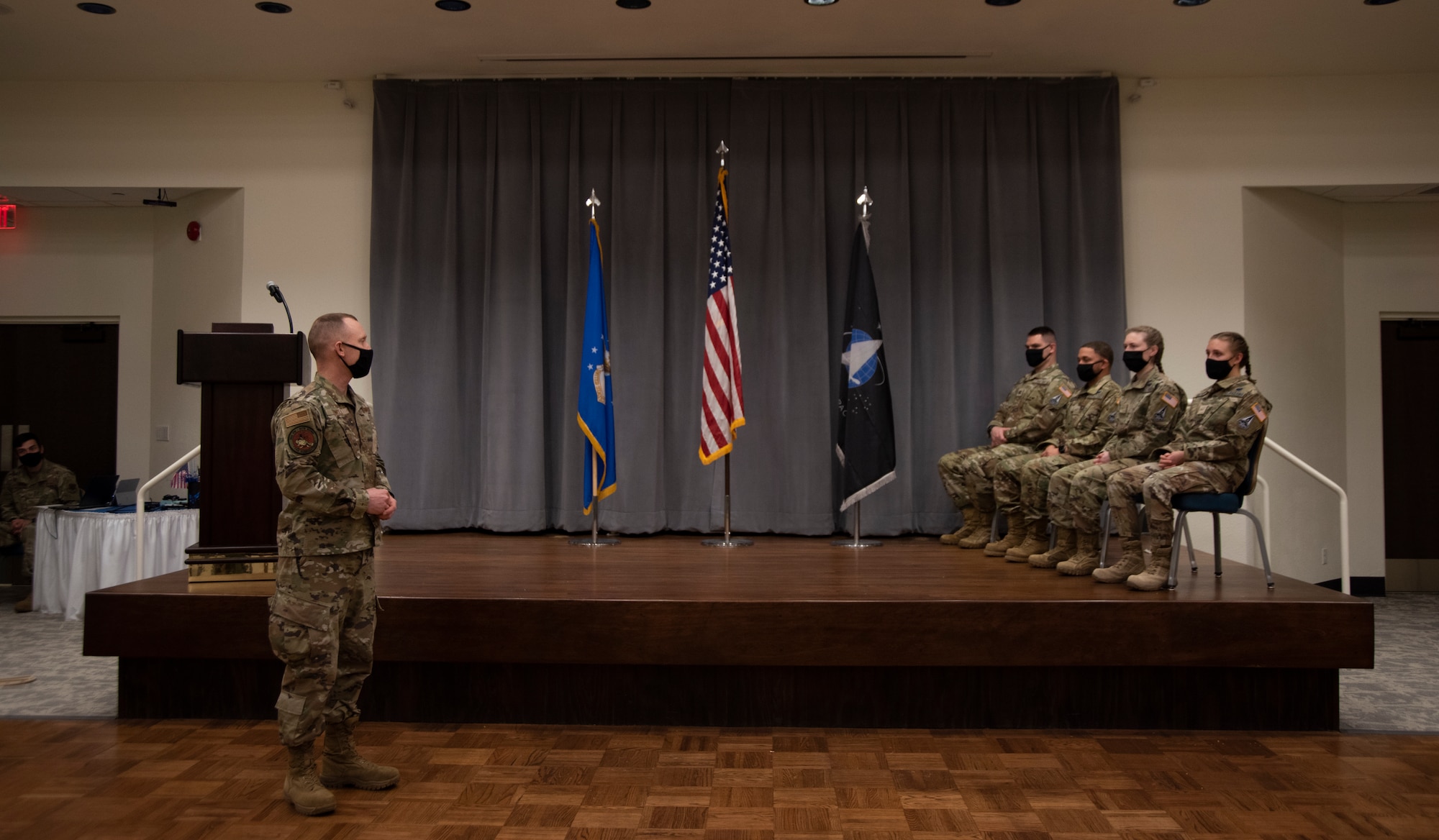 An Airman looks at the new Guardians and congratulates them on their transfer from the Air Force to Space Force.