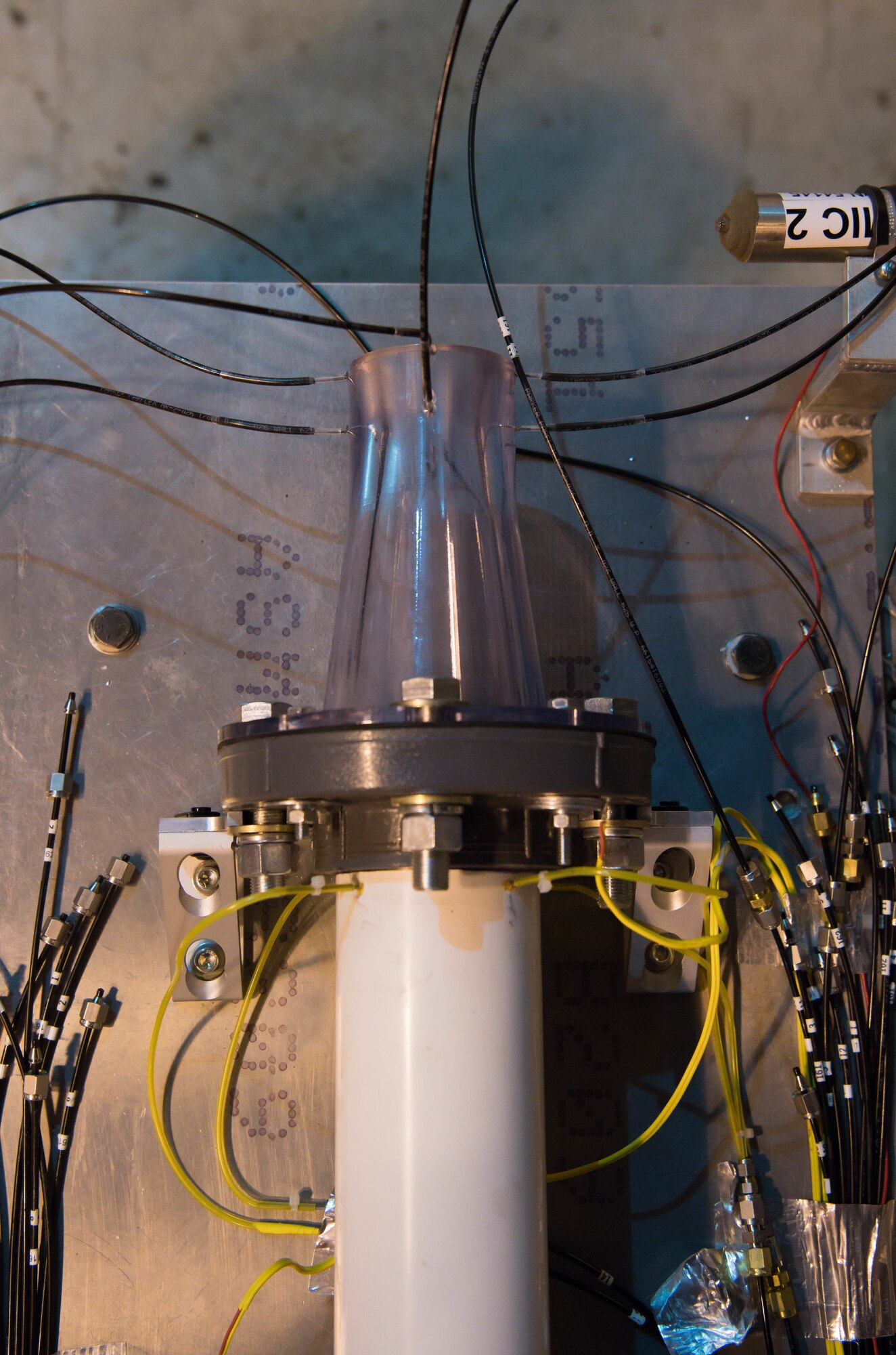 A nozzle is connected to a testing apparatus in the Sea Level 2 Test Cell, Dec. 17, 2020, at Arnold Air Force Base, Tenn. An Arnold Engineering Development Complex Propulsion Test Branch test team was investigating acoustic properties of the nozzle. (U.S. Air Force photo by Jill Pickett)
