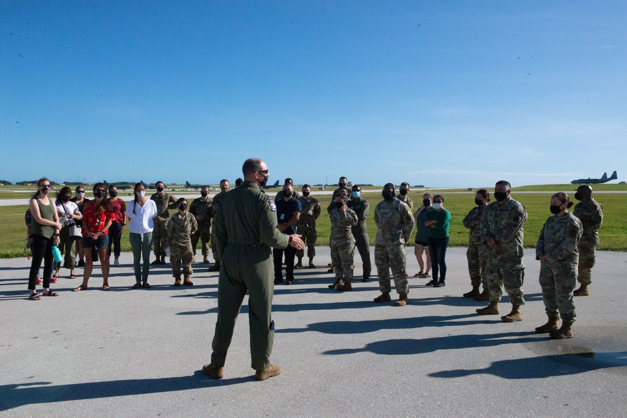 Lt. Col. Jeremy Stuursma, 36th Wing chief of safety teaches the 36th Contingency Response Group observers on what aircraft they'll see during  their Exercise Cope North 2021 flight line engagement at Andersen Air Base, Guam, Feb. 10, 2021.