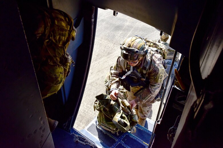 Soldiers board an airplane