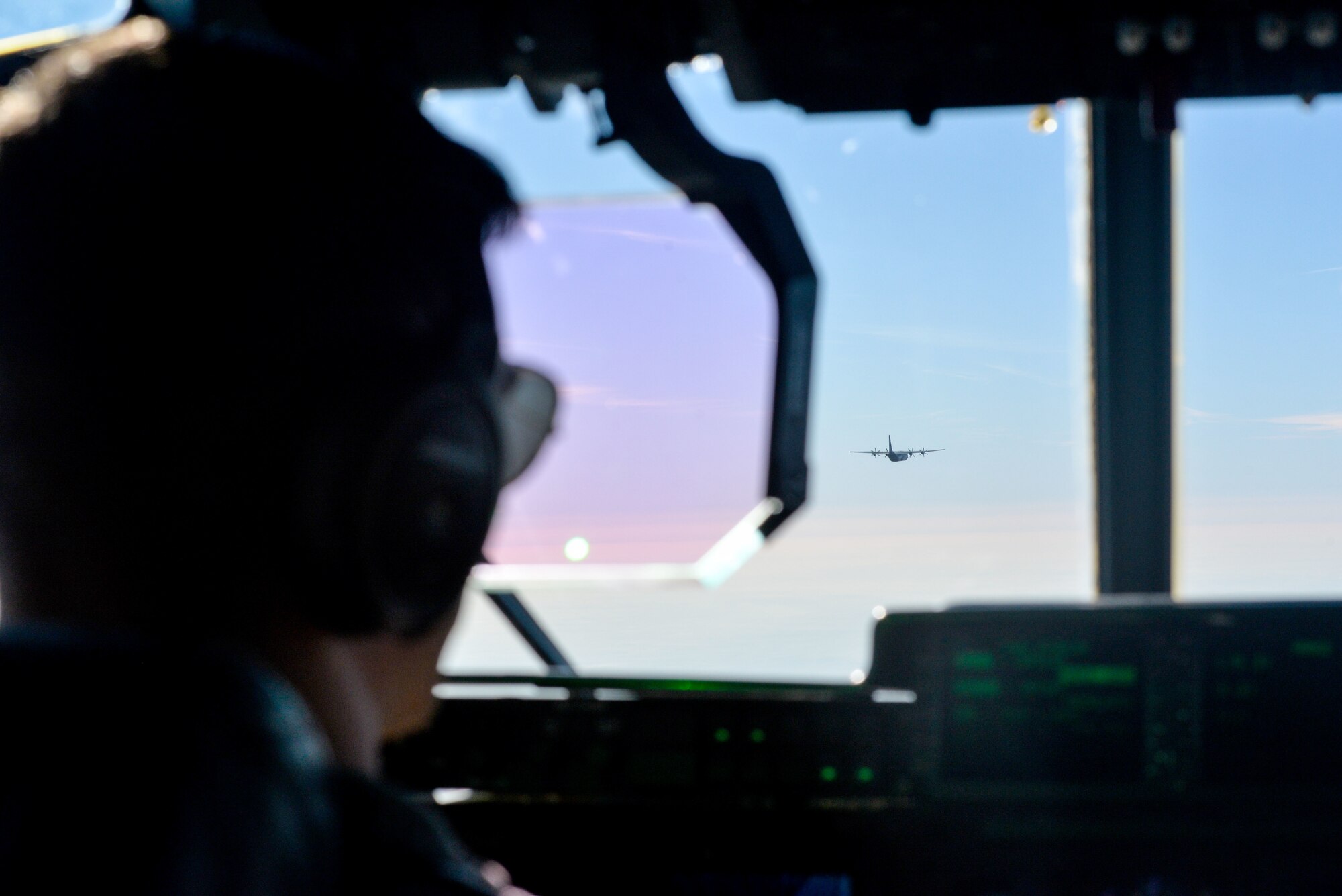 A pilot flies in formation