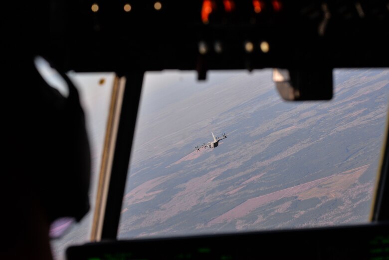 A pilot flies in formation