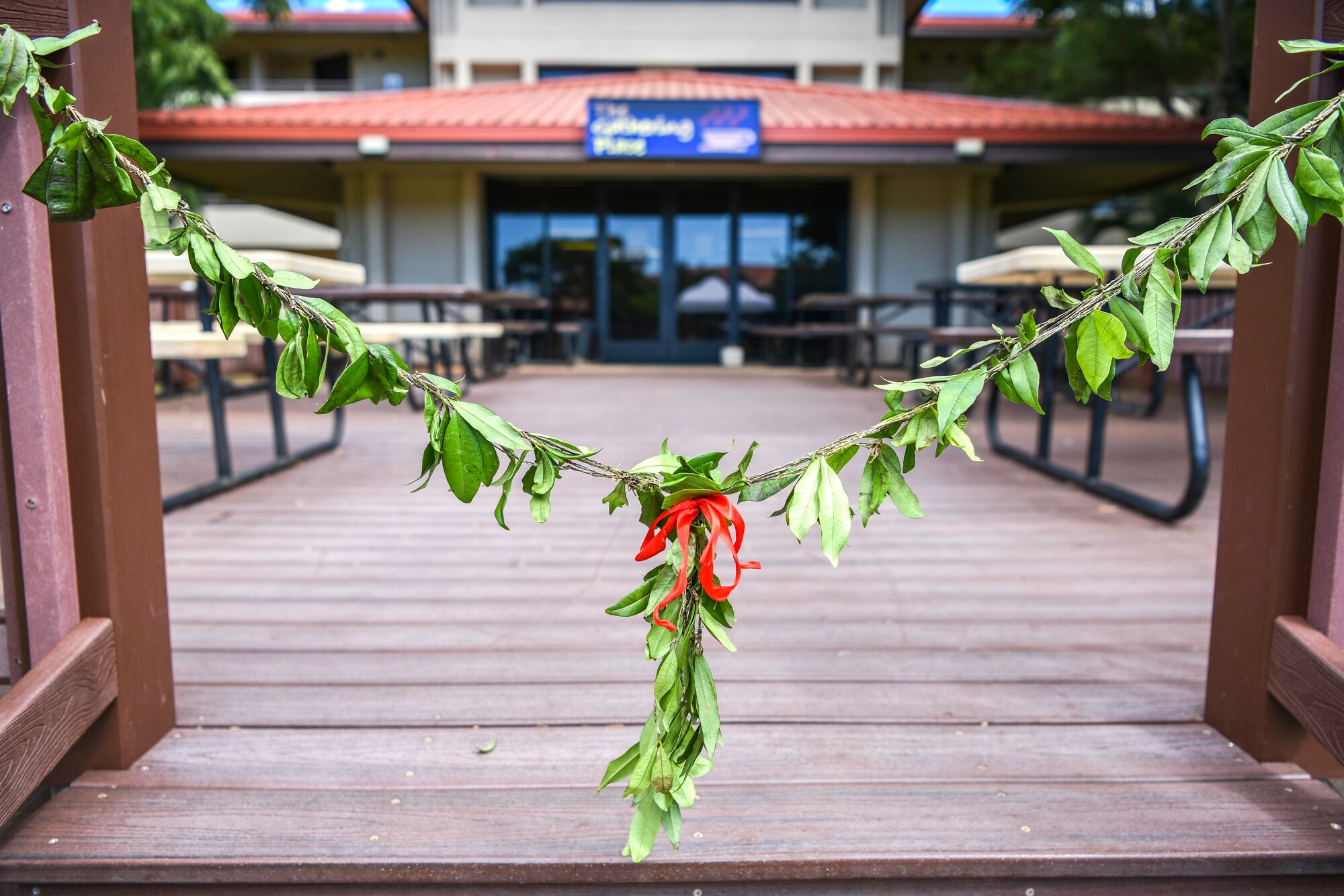 A Hawaiian lei rests in the entryway of the Gathering Place at Joint Base Pearl Harbor-Hickam, Hawaii, Feb. 11, 2021. The Gathering Place serves as a joint operation, giving Airmen, Soldiers, Sailors, and Guardians an opportunity to connect in a singular effort to ease the stressors of integrating servicemembers into a new and much bigger military family. (U.S. Air Force photo by Tech. Sgt. Anthony Nelson Jr.)