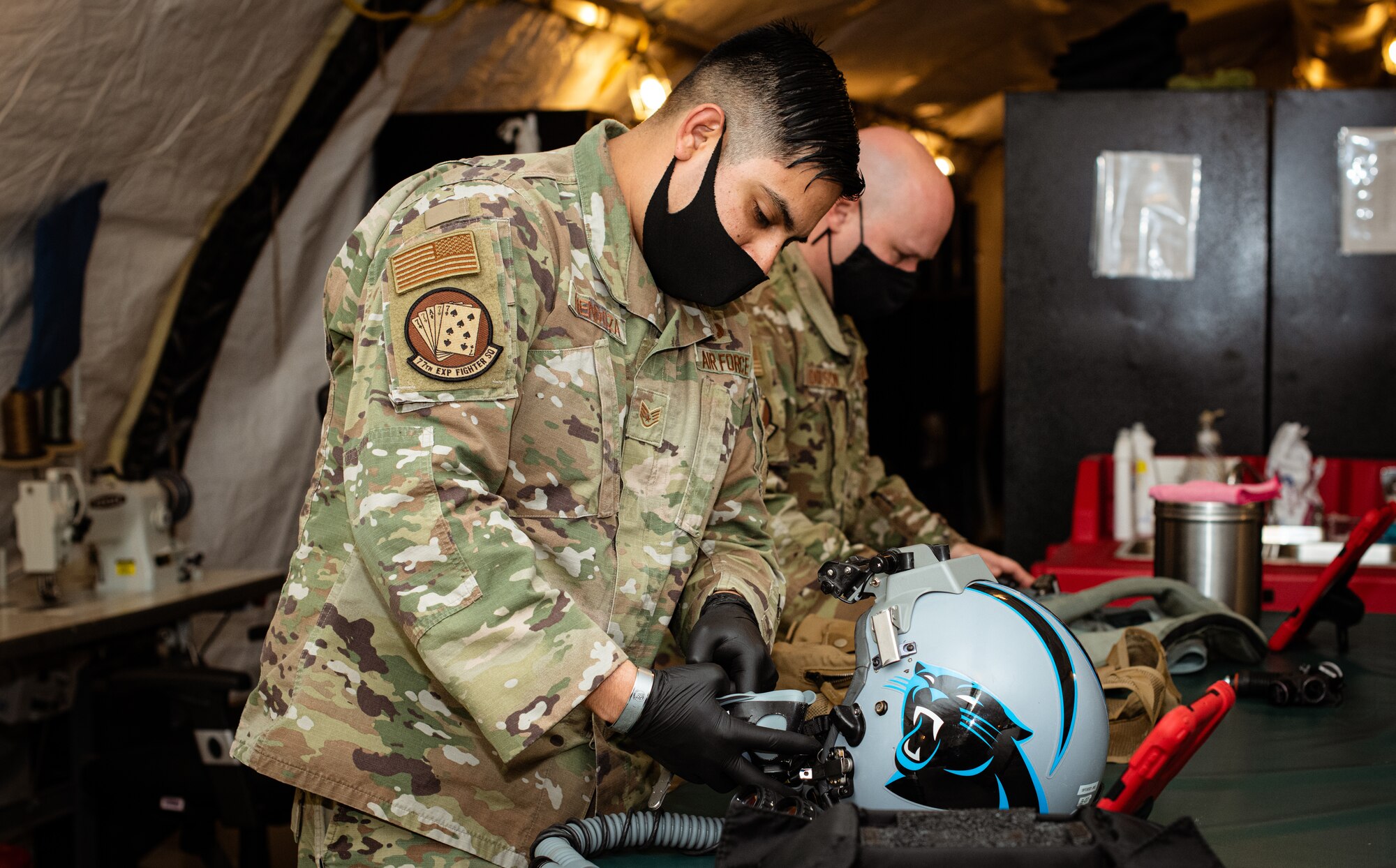 Airmen from the 378th Expeditionary Fighter Squadron aircrew flight equipment perform maintenance on equipment Feb. 11, 2021, at Prince Sultan Air Base, Kingdom of Saudi Arabia.