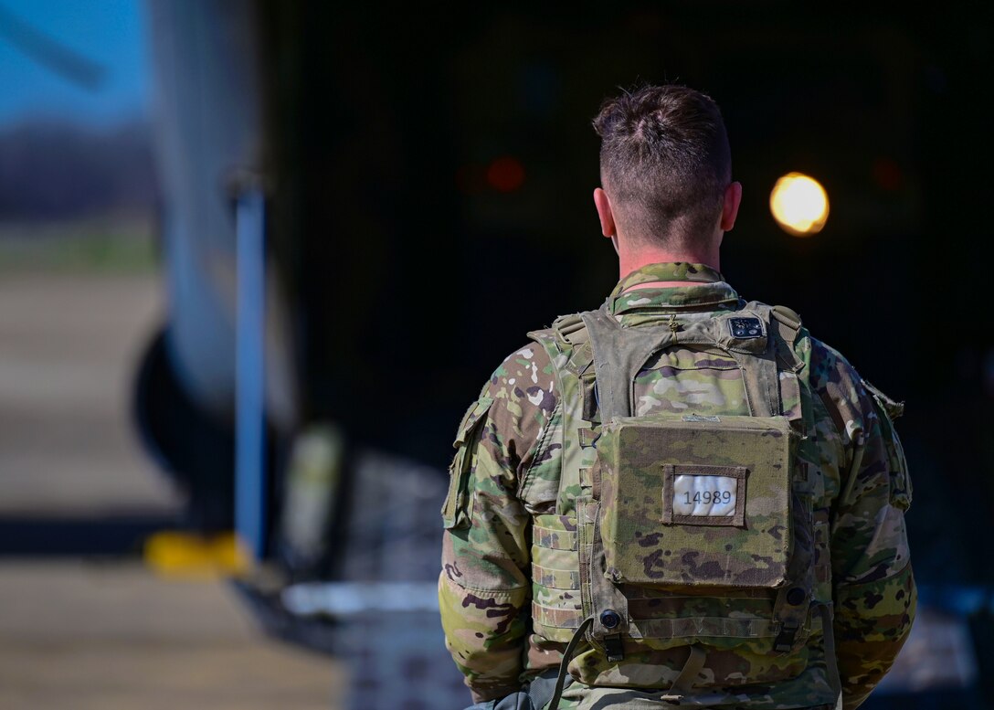 A person walks cargo loading operations