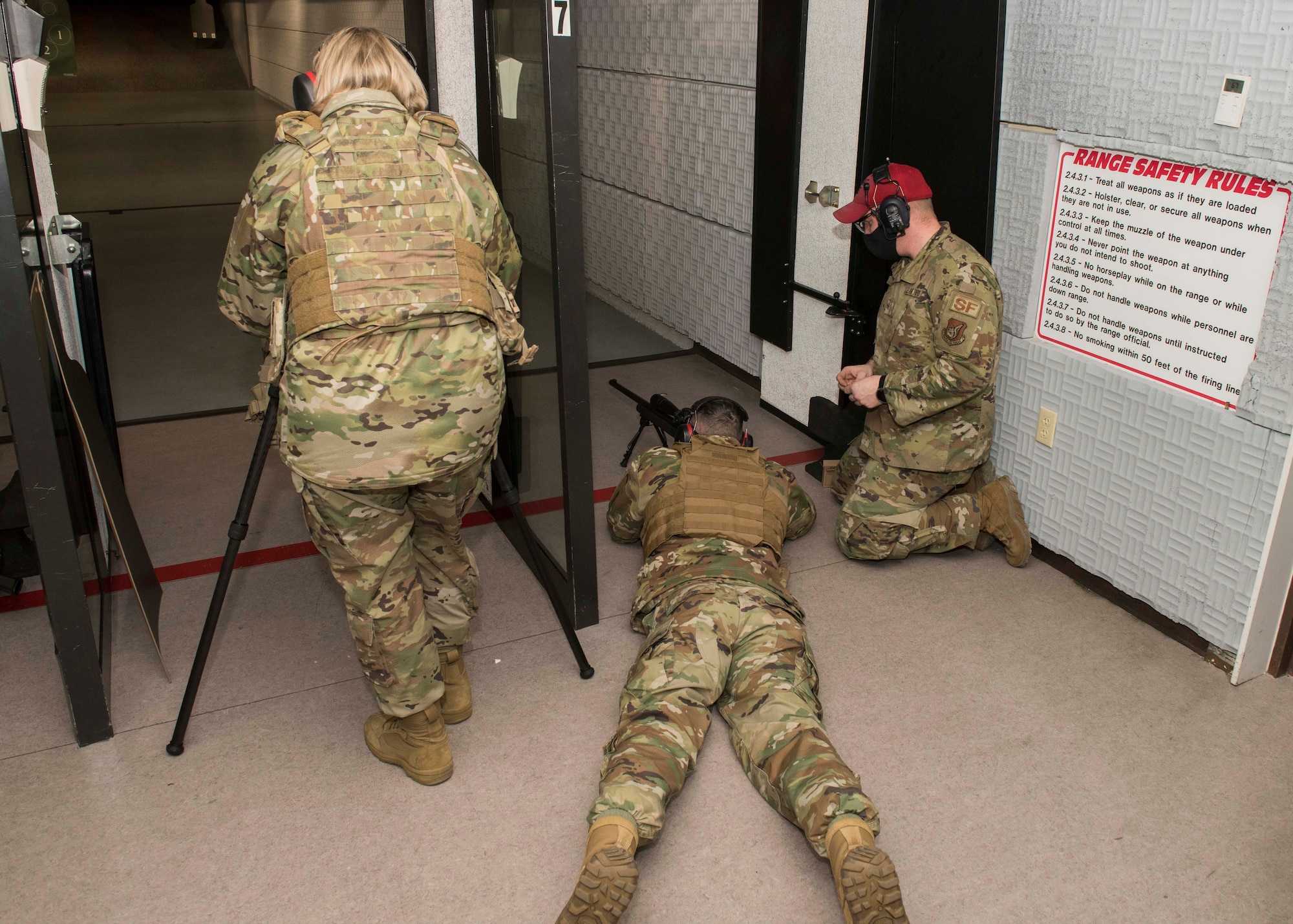 U.S. Air Force Col. Kirsten Aguilar, the Joint Base Elmendorf-Richardson and 673d Air Base Wing commander, looks through a scope during an immersion with the 673d Security Forces Squadron at JBER, Alaska, Feb. 2, 2021. The tour familiarized base leadership with the 673d SFS and its role in maintaining the safety of the JBER community and security of the installation and its resources.