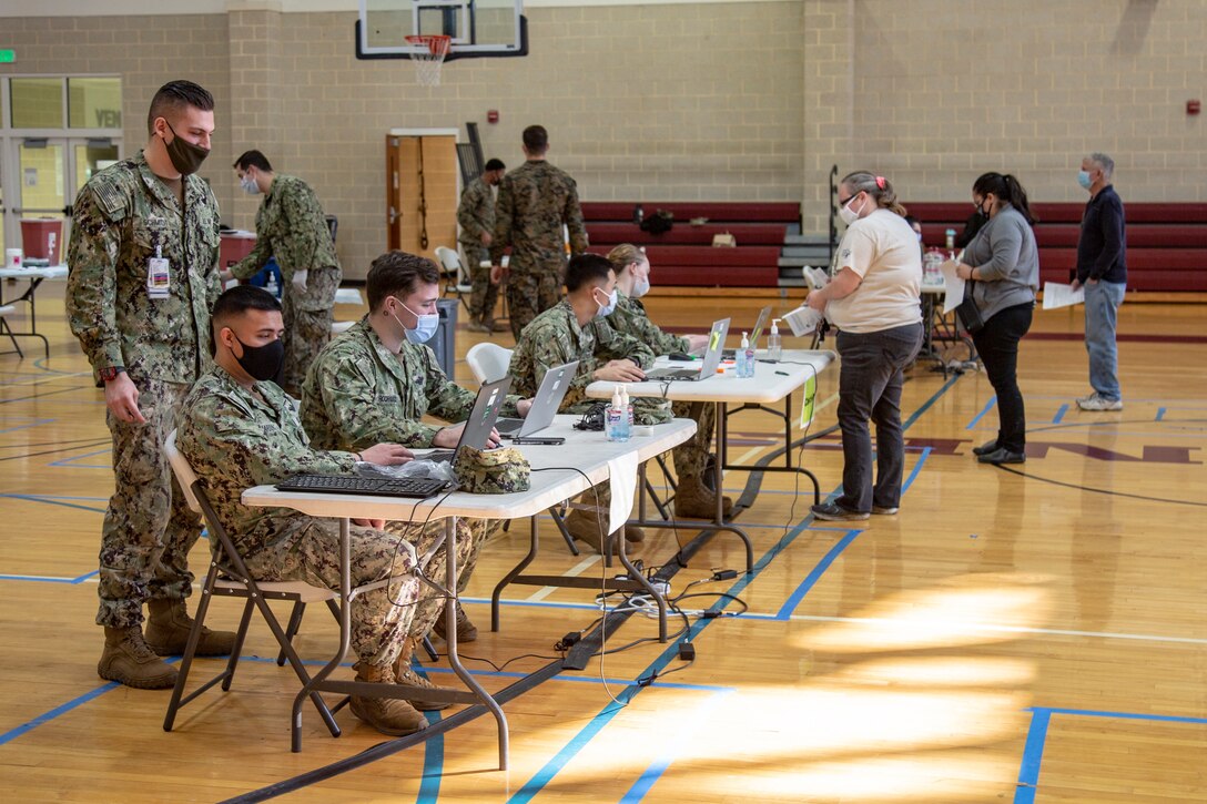 Vaccination stations have been set up at Wallace Creek Fitness Center gym which is now operating as a mass COVID-19 vaccination center to support Marine Corps Installations East personnel and beneficiaries on Marine Corps Base Camp Lejeune, North Carolina, Feb. 16, 2021. Beginning Feb. 16, 2021, Naval Medical Center Camp Lejeune personnel will be able to provide vaccinations for any eligible personnel with the capability of vaccinating up to 2000 people per day. (U.S. Marine Corps Photo by Lance Cpl. Isaiah Gomez)