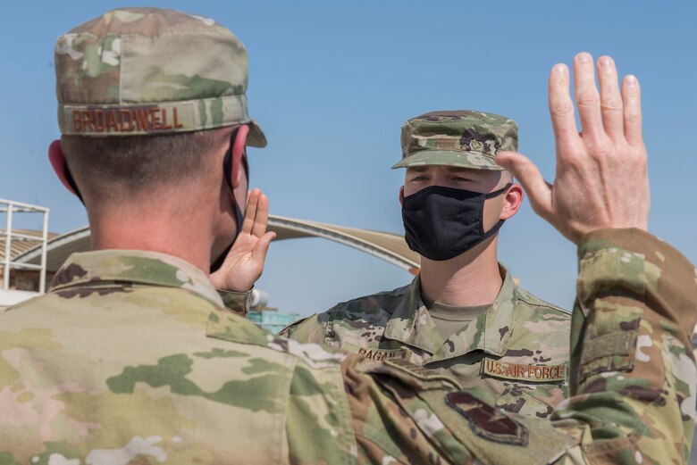 A U.S. Space Force defender assigned to the 380th Air Expeditionary Wing takes the oath of enlistment during a transfer ceremony at Al Dhafra Air Base, United Arab Emirates, Feb. 5, 2021.