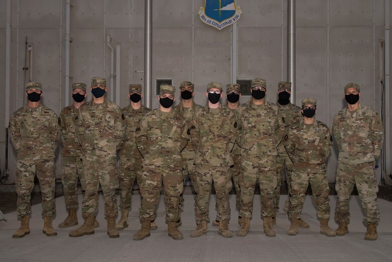 U.S. Space Force defenders assigned to the 380th Air Expeditionary Wing pose with wing leadership following a transfer ceremony at Al Dhafra Air Base, United Arab Emirates, Feb. 12, 2021.
