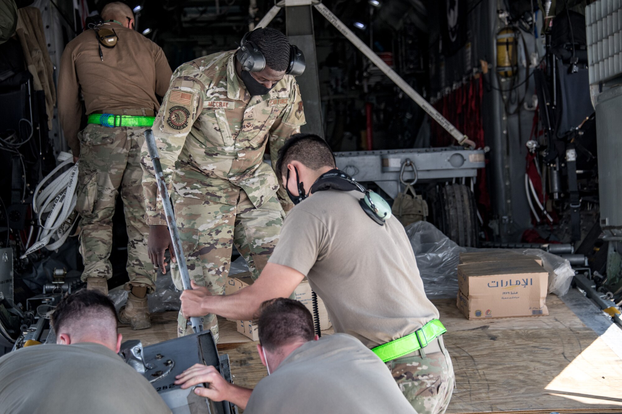 Airmen unload equipment from a C-130