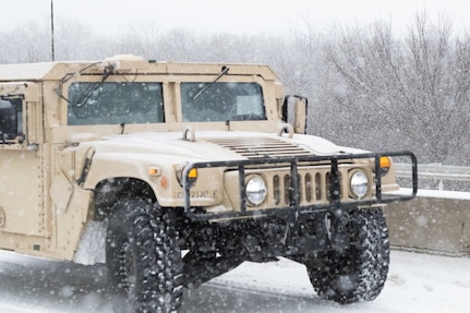 An Oklahoma Army National Guard HUMVEE moves through the snow near Stroud, Oklahoma. The Oklahoma Army National Guard in partnership with the Oklahoma Highway Patrol responded to numerous calls for help caused by severe weather conditions Feb. 14-15, 2021, as part of eight Stranded Motorist Assistance Recovery Teams (SMART) made up of nearly 90 Soldiers.