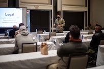 Task Force Northeast Staff Judge Advocate Maj. Jason De Los Santos speaks to members of the Urban Augmentation Medical Task Force-531, based out of Fort Campbell, Ky., during a joint reception, staging, onward movement, and integration brief in New Jersey in support of COVID-19 vaccine operations.