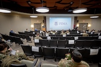 Members of the Urban Augmentation Medical Task Force-531, based out of Fort Campbell, Ky., attend a Federal Emergency Management Agency reception, staging, onward movement, and integration brief at the New Jersey Air National Guard Training Center Headquarters, in support of COVID-19 vaccine operations.
